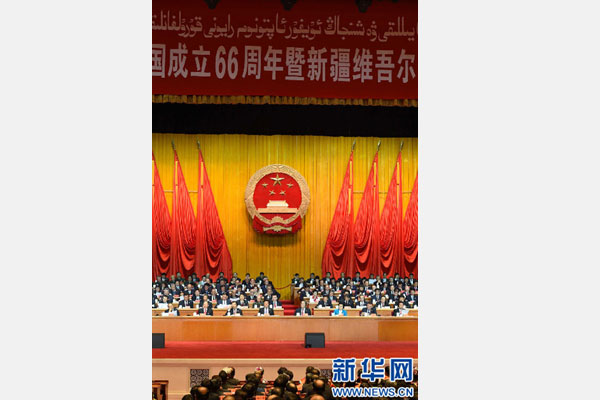 10月1日，慶祝中華人民共和國成立66周年暨新疆維吾爾自治區(qū)成立60周年大會在新疆人民會堂隆重舉行。 新華社記者 高潔 攝 