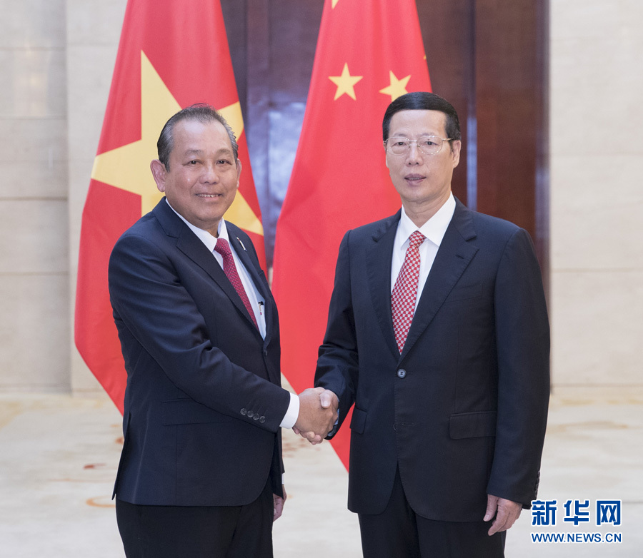  9月11日，中共中央政治局常委、國務院副總理張高麗在廣西南寧會見前來出席第十四屆中國－東盟博覽會和中國－東盟商務與投資峰會的越南常務副總理張和平。新華社記者王曄攝