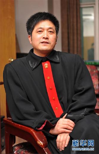 （圖文互動(dòng)）其人如蘭，既潔且馨——追記“全國模范法官”胡國運(yùn)